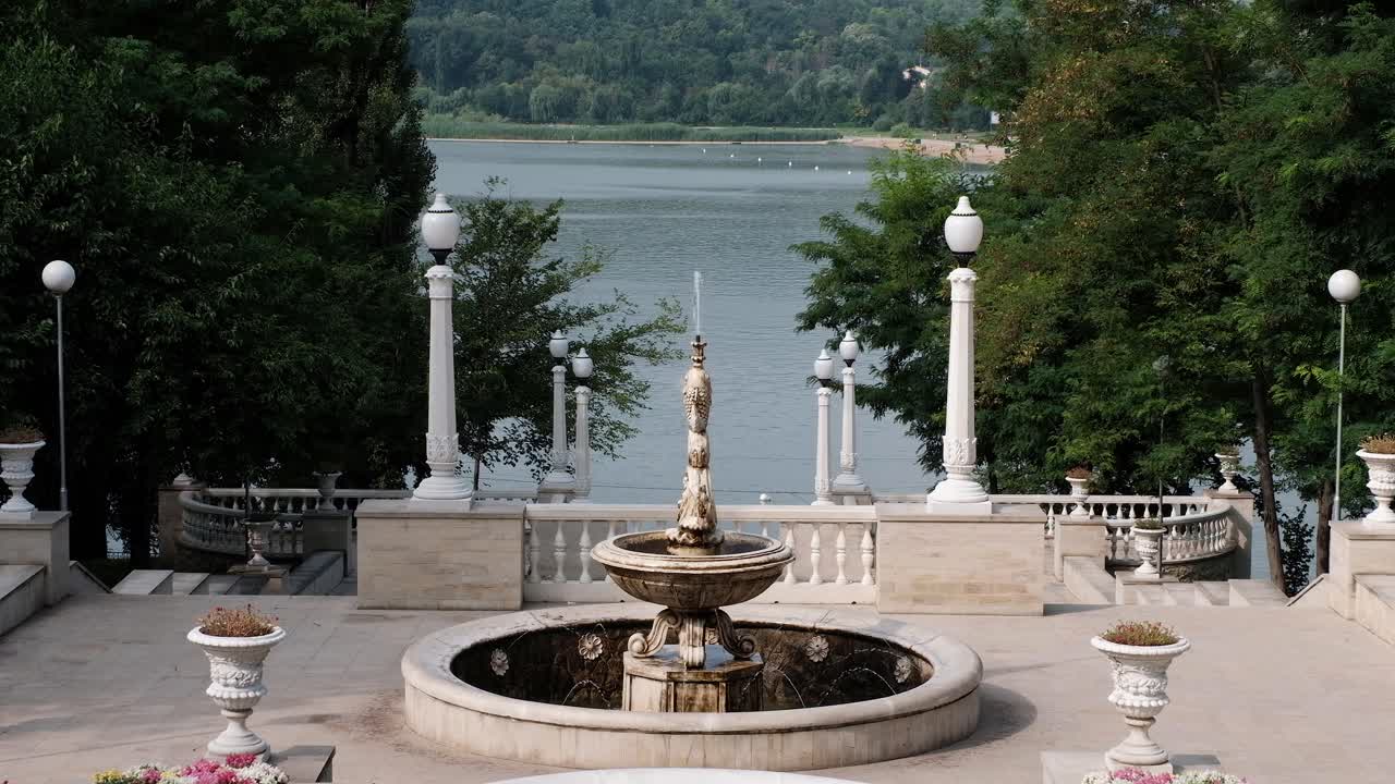 Scenic Fountain by a Lake
