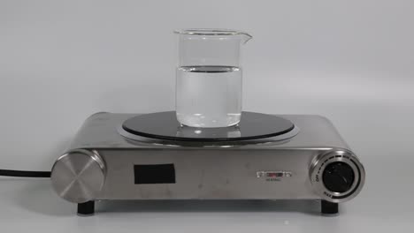 sequential heating of water in a beaker on a stove