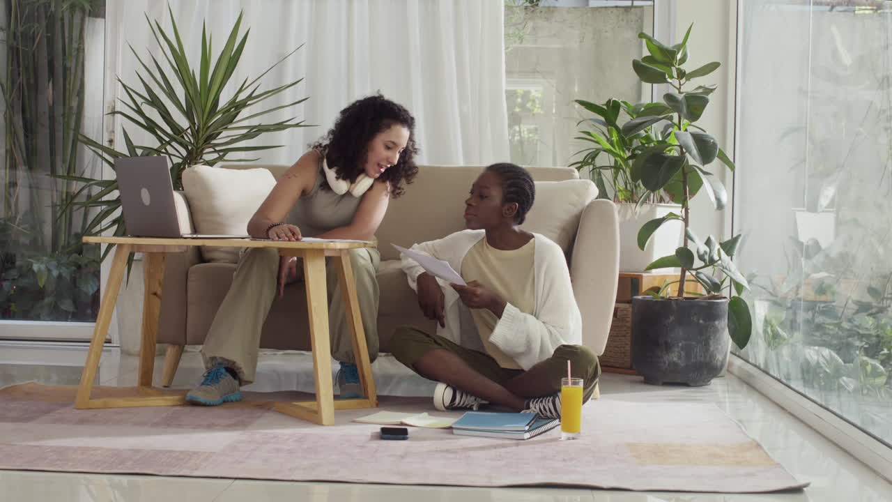 Diverse Girls Working on School Project at Home