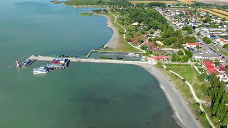 lake neusiedl, austria - a scenic vista of a serene lake surrounded by lush greenery - aerial drone