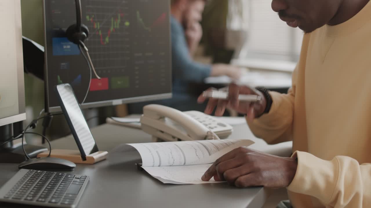 Broker Examining Documents in Office