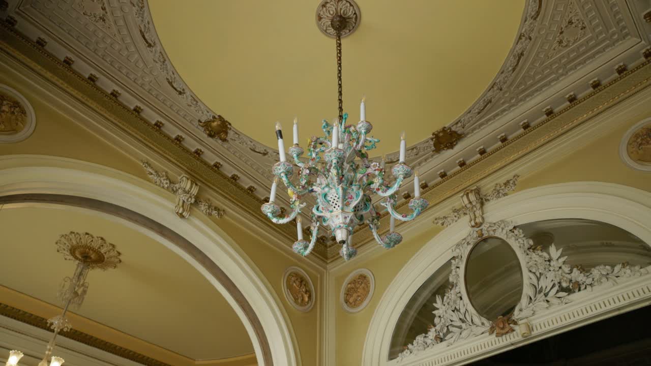Chandelier Under Decorated Ceiling In The Interior - Low Angle Shot