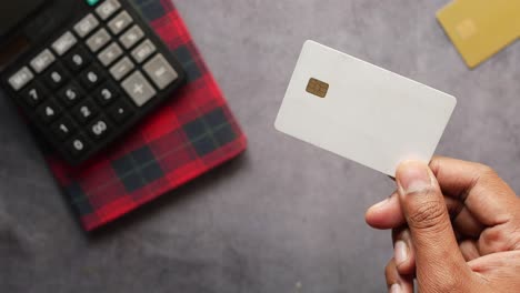 close up of person hand holding credit card