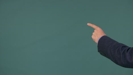 left male hand touching or sliding on green background. gesture finger and hand. pointer finger.