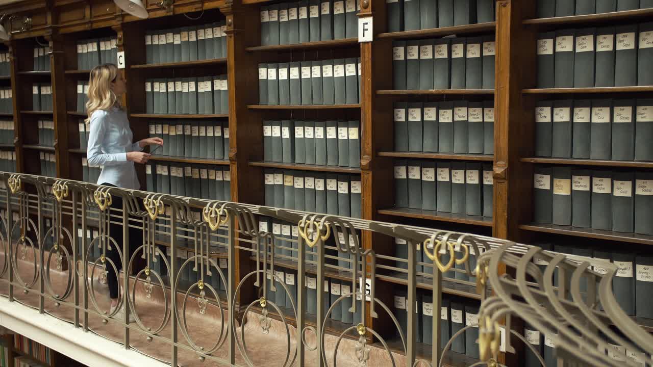 Woman Searching Through Archives in Library