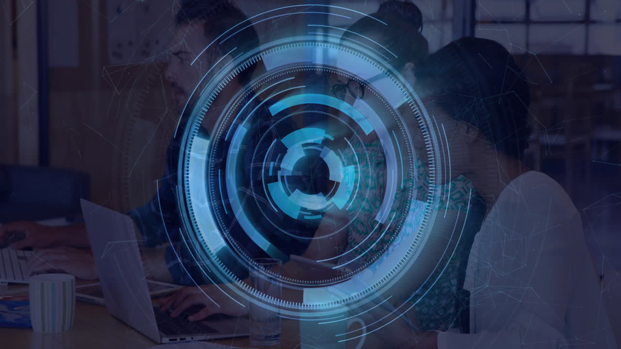 Digital interface animation over diverse team collaborating at office desk