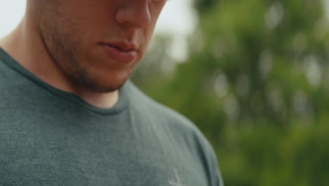 close up of a person holding a roll of adhesive tape