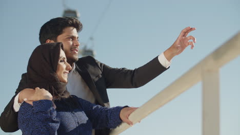 Arabic-Middle-East-couple-standing-near-bridge-railing