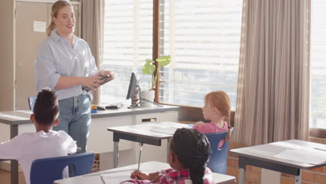 teaching in classroom, female teacher engaging with students in school setting