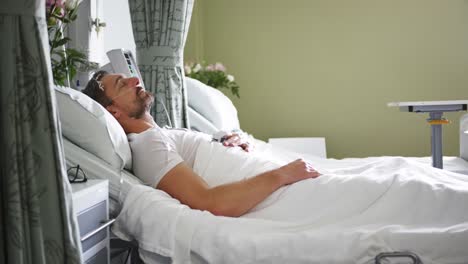 man lying in a hospital bed 4k