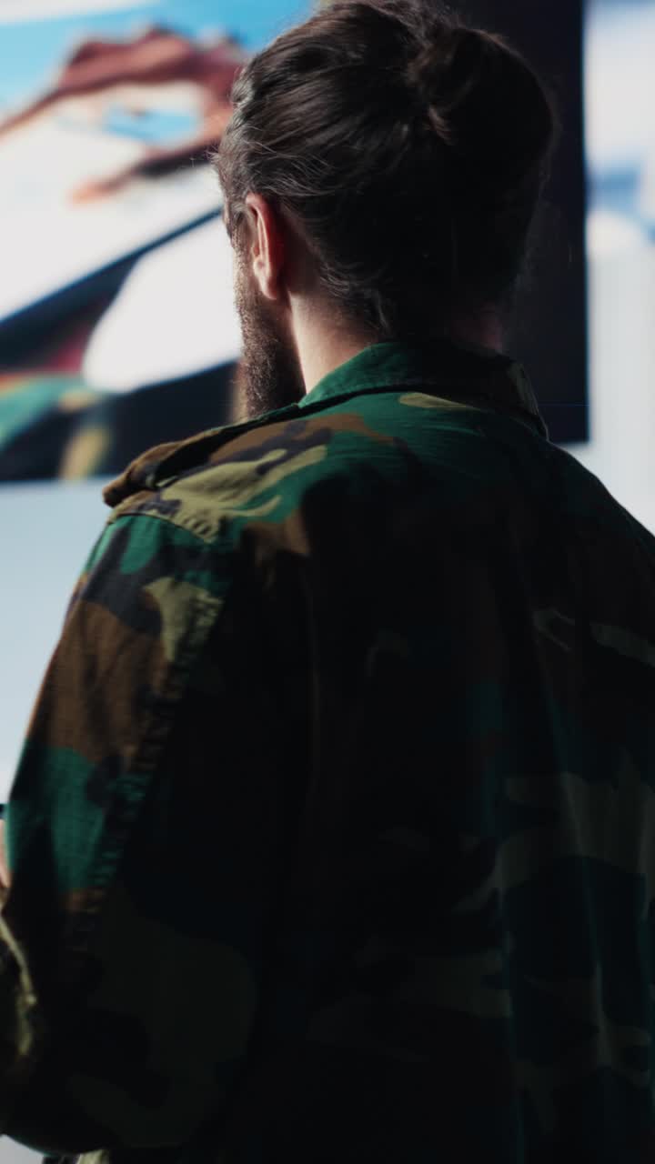 Vertical Video Military officer engaged in tactical command and surveillance activity