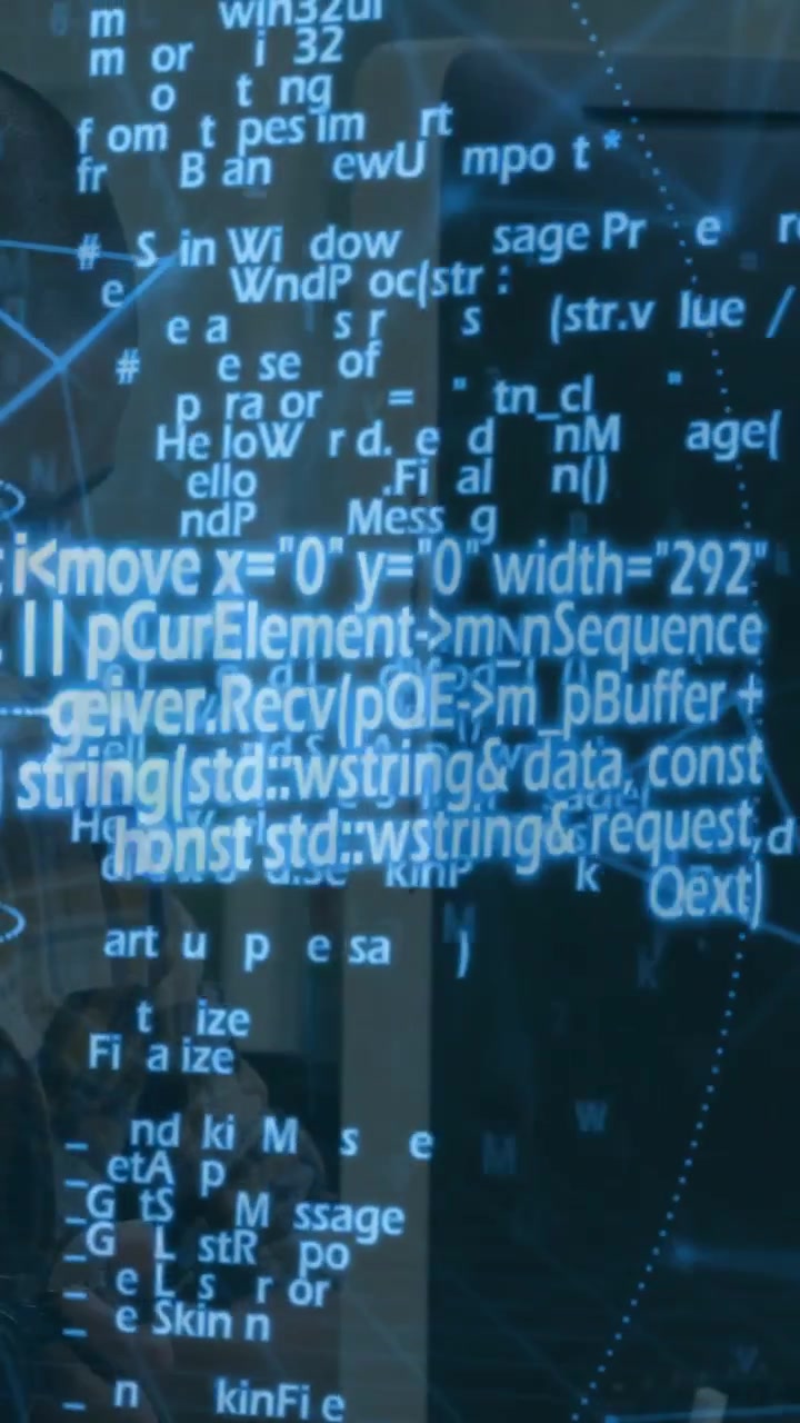 Man sitting left watching monitor tapping device and activating tech code overlay rising