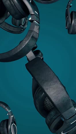 black headphones floating on a teal background