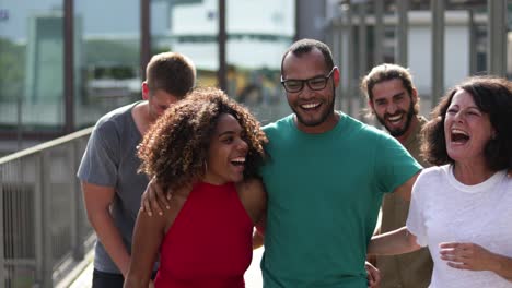 happy friends walking and laughing outdoor