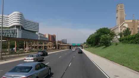 highway with traffic and buildings