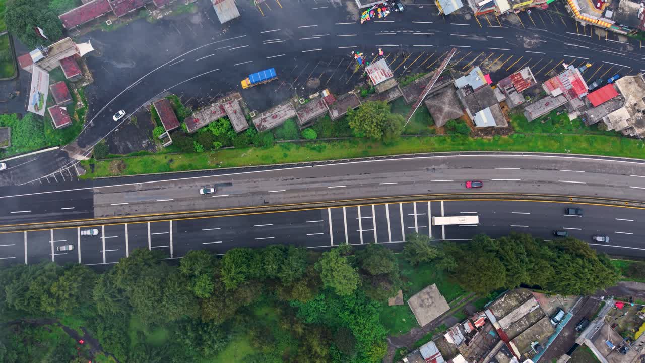 Stunning drone shots of misty roads winding through a Mexican forest