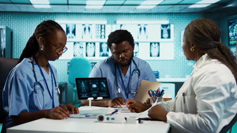 medical professionals collaborating using diagnostic tools and data