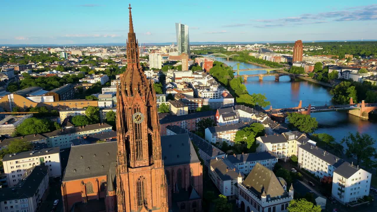 4K Drone Video of the Gothic-Style Kaiserdom St. Bartholomäus Cathedral with the Modern European Central Bank Building in the Distance on the Main River in Downtown Frankfurt, Germany