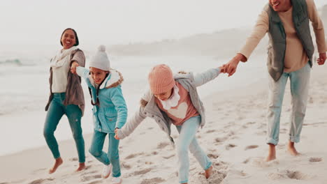 Bonding,-walking-and-family-holding-hands-on-beach