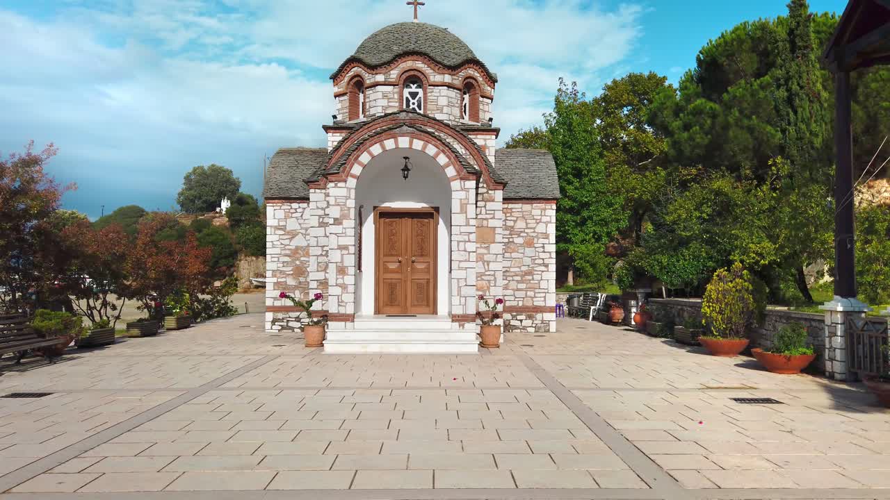Saint Nicolas Orthodox Chapel in Olympiada with a lot of greenery around, Greece