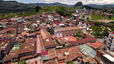 umbrella colourful street and colonial cathedral in guatape picturesque village