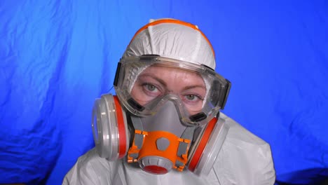 scientist virologist in respirator. woman close up look, wearing protective medical mask. concept health safety n1h1 coronavirus epidemic 2019 ncov.