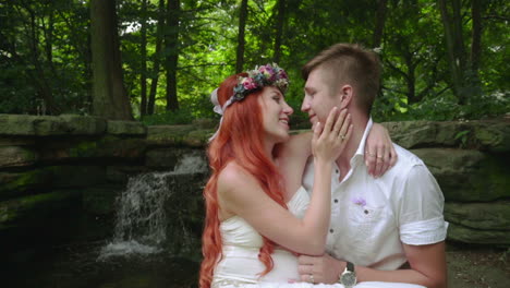 Love-couple-kissing.-Close-up-of-romantic-couple-kiss-near-waterfall