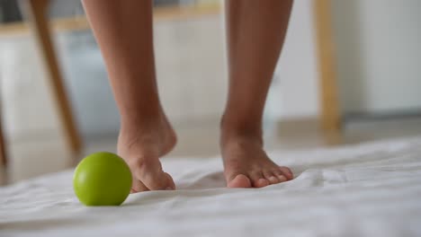 Barefoot Exercise with a Green Ball