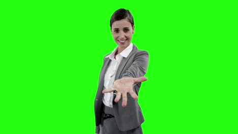 Businesswoman-gesturing-against-green-screen