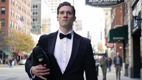 a confident man in formal attire walks elegantly through the city streets, embracing the urban environment with style and purpose on a bright day