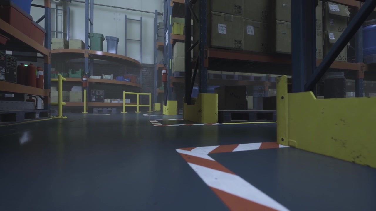 Daylight warehouse scene with organized storage and industrial work