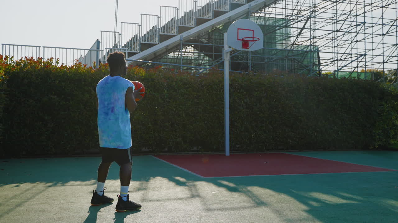 Man Dribbling Basketball Outdoors