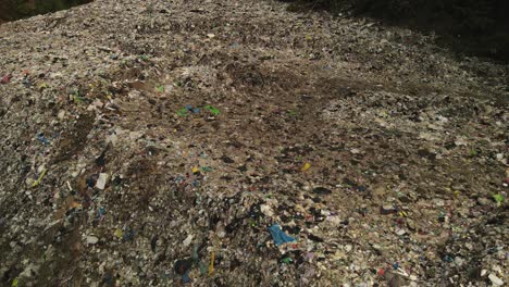 aerial descending footage of land fill garbage dump in the tropics in thailand