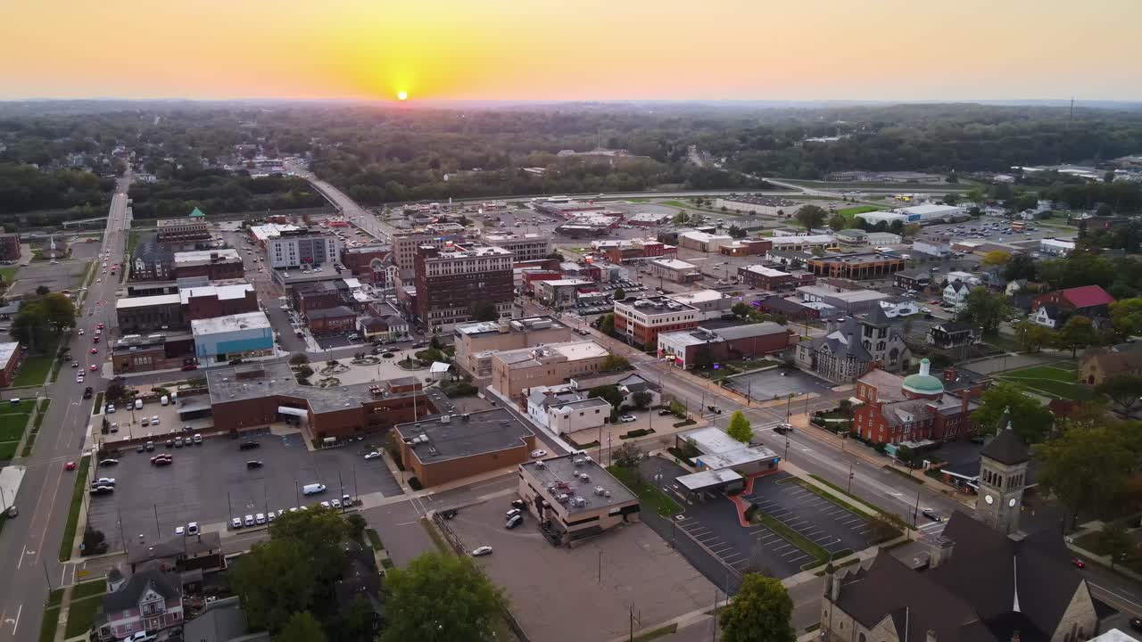 Aerial view of downtown Massillon, Ohio at sunset featuring historic buildings and streets. Crane Up Sunset W