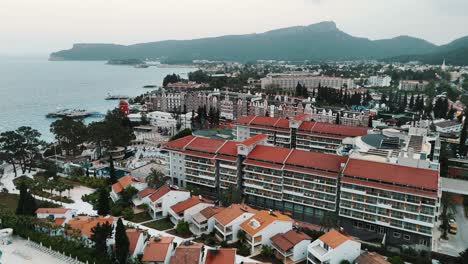 Drone-View-of-Kemer-City-of-Antalya,-Resort-Town-on-Mediterranean-Coast-of-Turkey