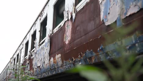 old rusty abandoned train sitting in the graveyard