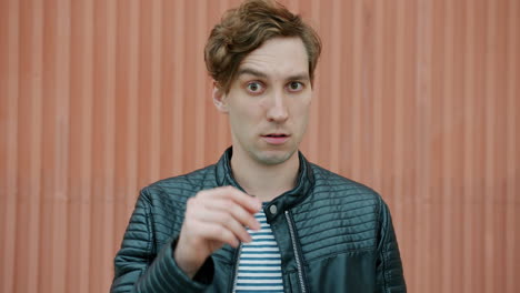 man expressing confusion and frustration