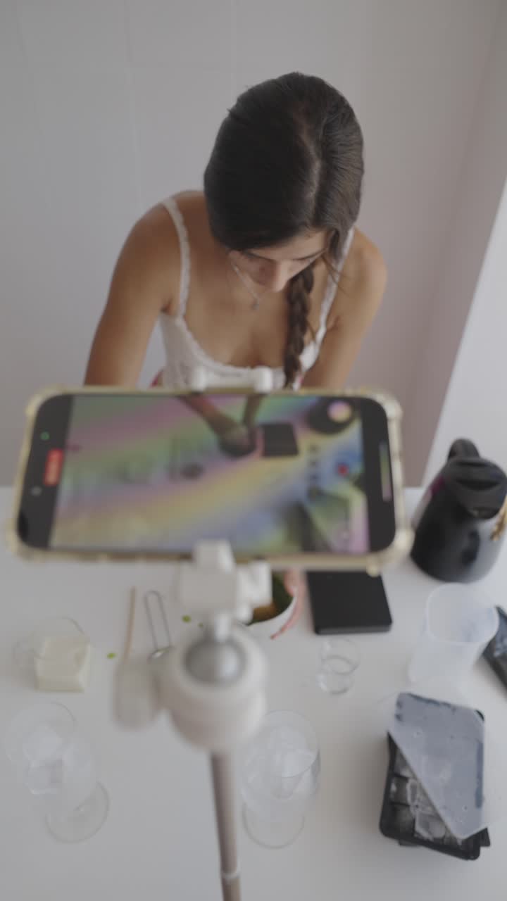 Woman Recording Tutorial with Smartphone on Tripod