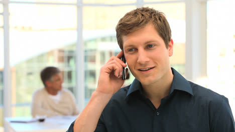 young man speaking on the phone