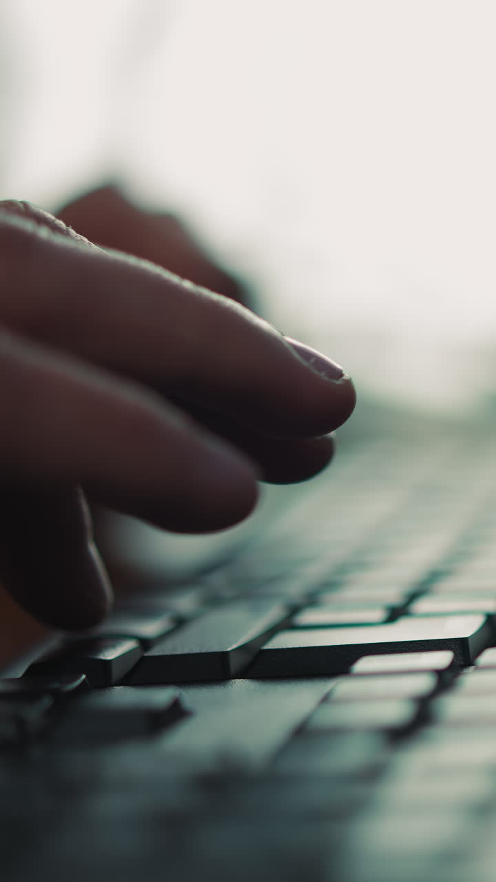 Person hands type on computer keyboard sitting at table closeup. Office worker enters information with keypad doing routine tasks at workplace