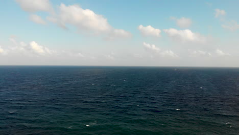 drone shot flying over ocean near mexico