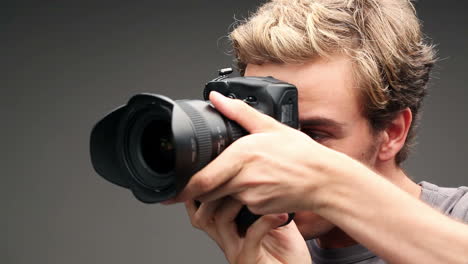 Photographer-man-taking-photographs-digital-camera