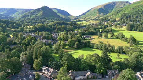 cinematic aerial view of the lakeland town of grasmere