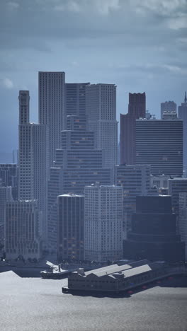 a cityscape with skyscrapers and a river