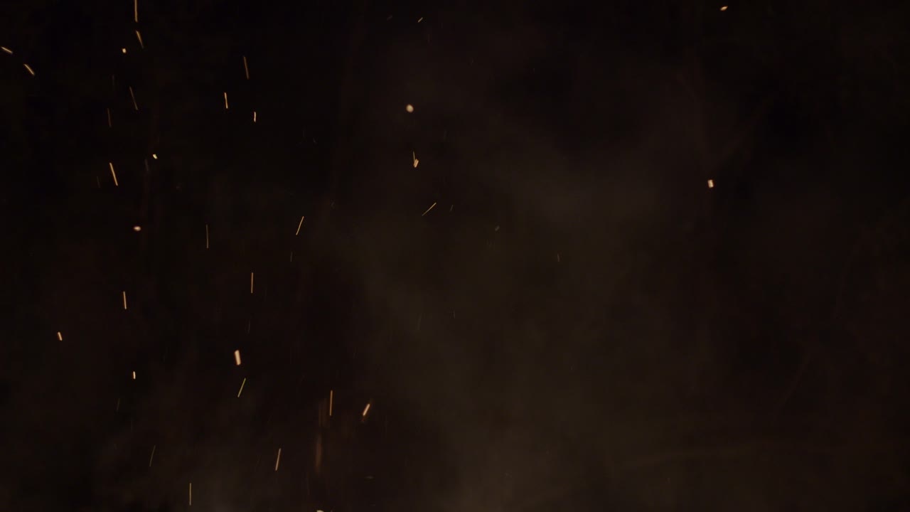 Close-up hot fiery sparkles and flame particles isolated spark