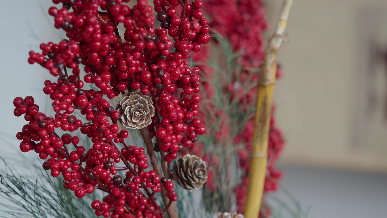 Close-up of Festive Red Berries and Pine Cones Christmas Decoration
