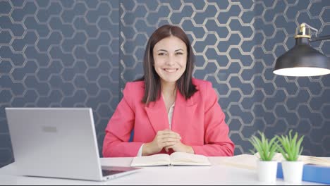 Young-business-woman-making-cute-gestures-to-the-camera.