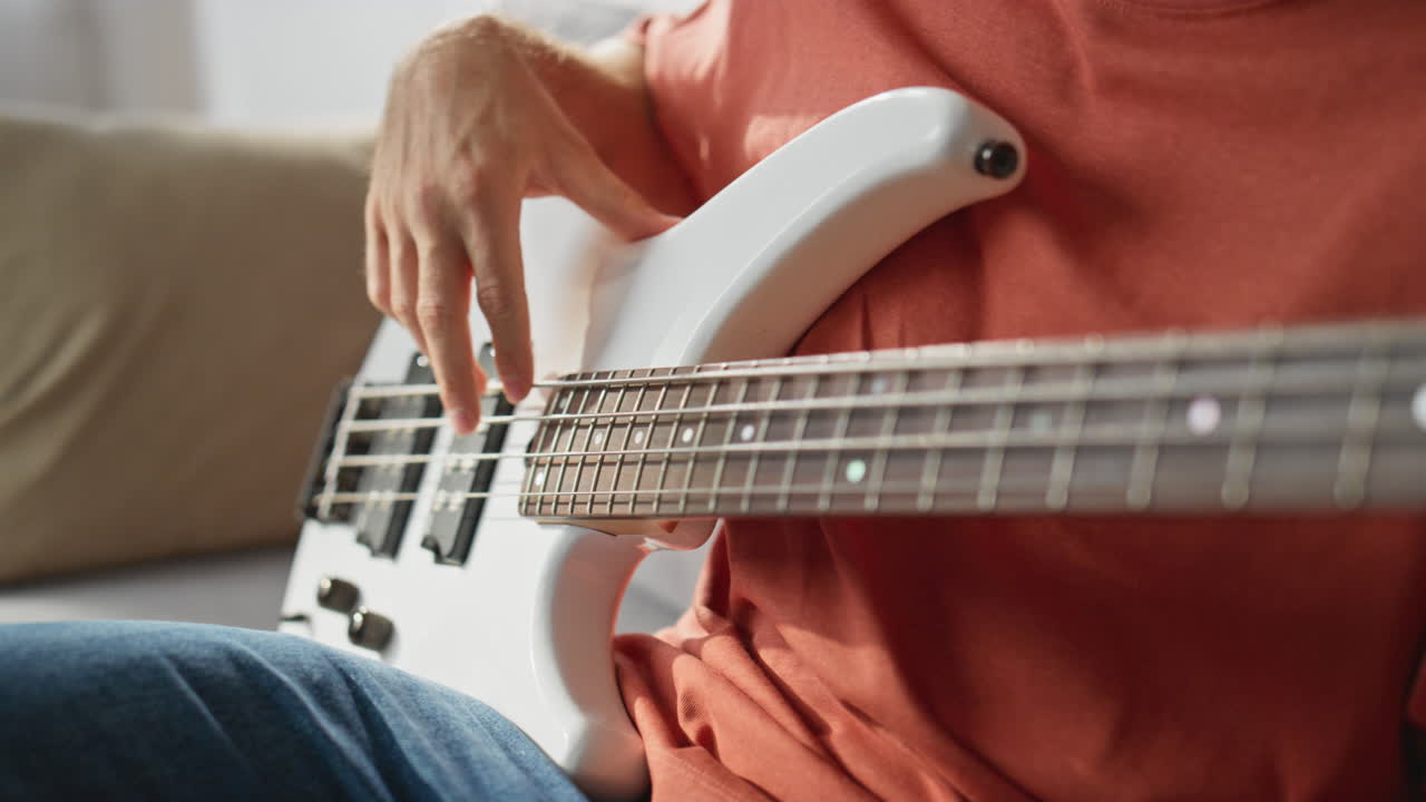 Closeup musician hands playing guitar home. Unknown guitarist touching strings