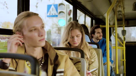 young man listening the music in the bus