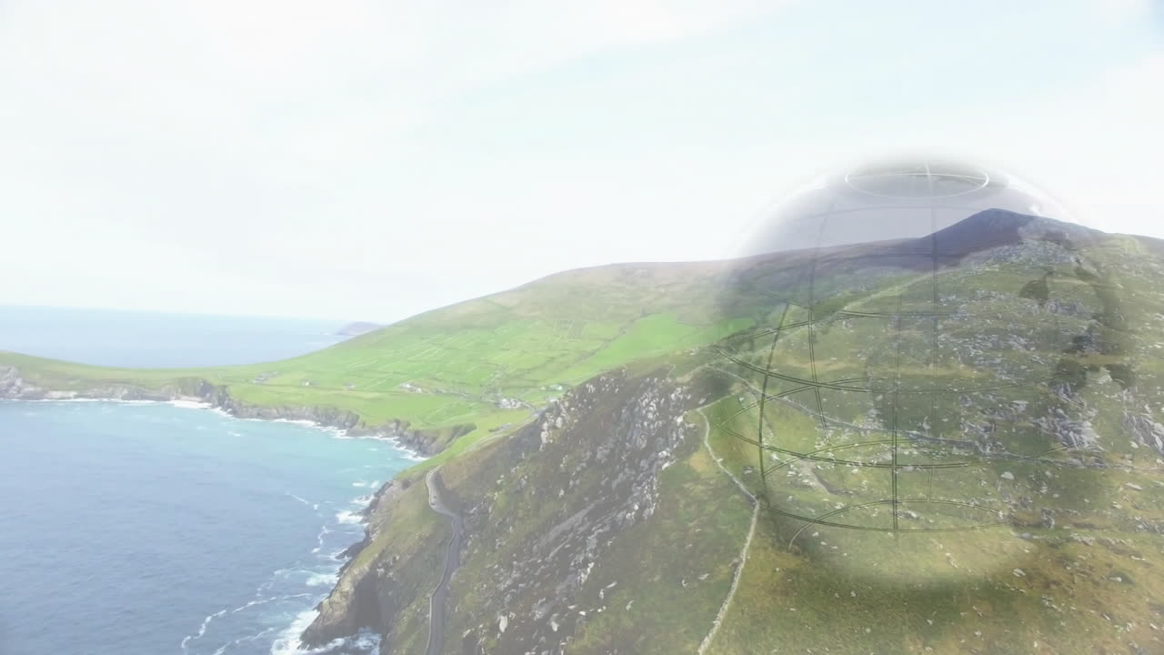 Coastal headland snaking along cliff while hovering transparent wireframe sphere grid above fields